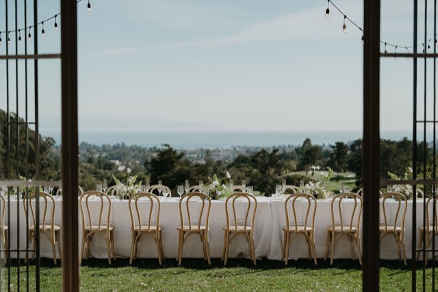 Long dinner table overlooking Santa Cruz from Hollins House