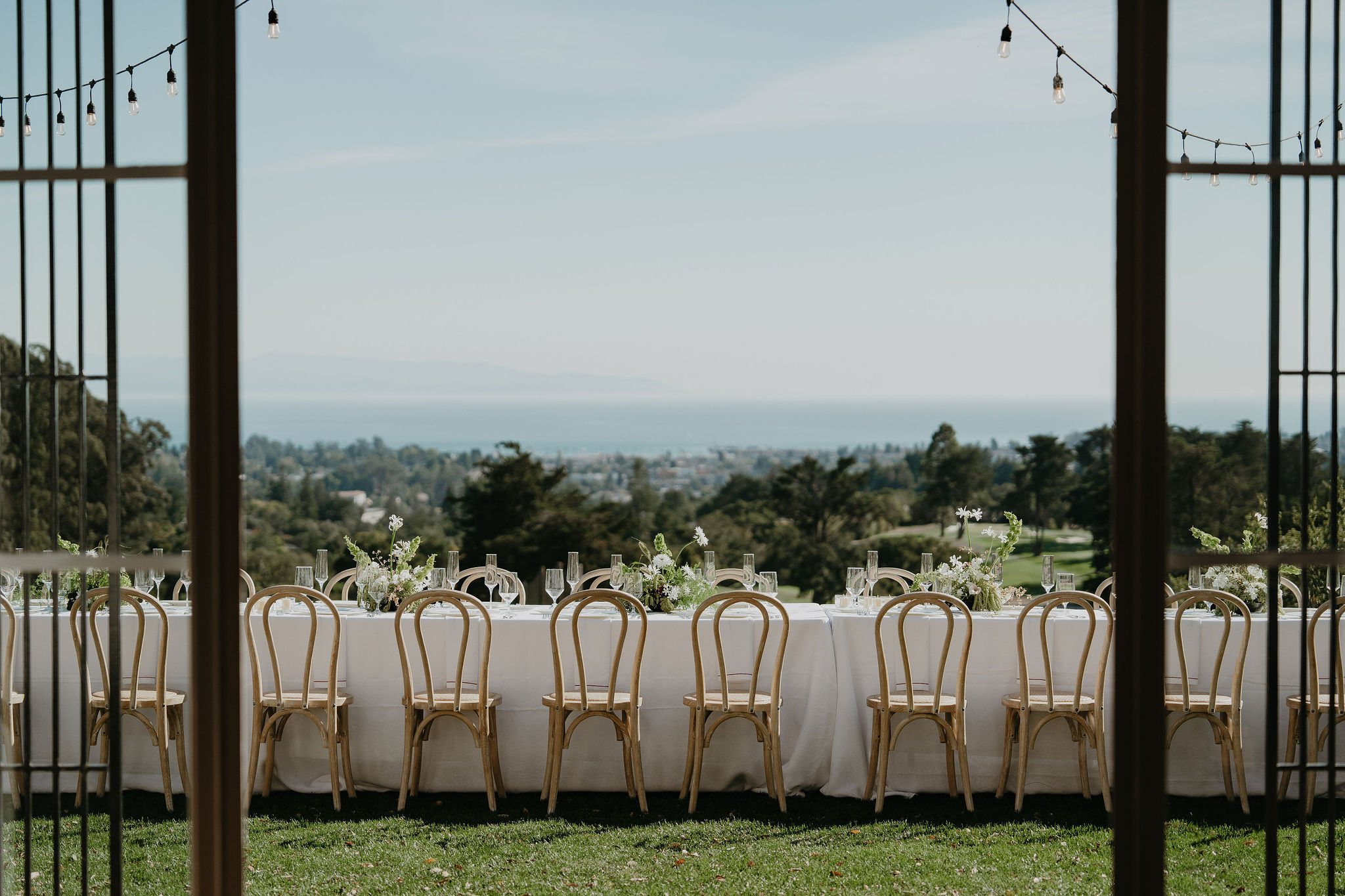 Long dinner table overlooking Santa Cruz from Hollins House